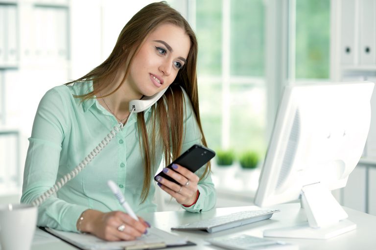 businesswoman talking on phone in office